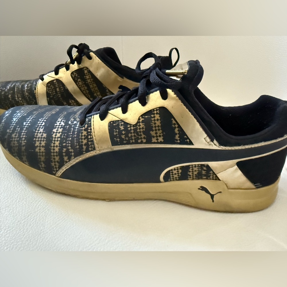 Puma Pulse XT Laser Etch shoes in a team gold and black colorway